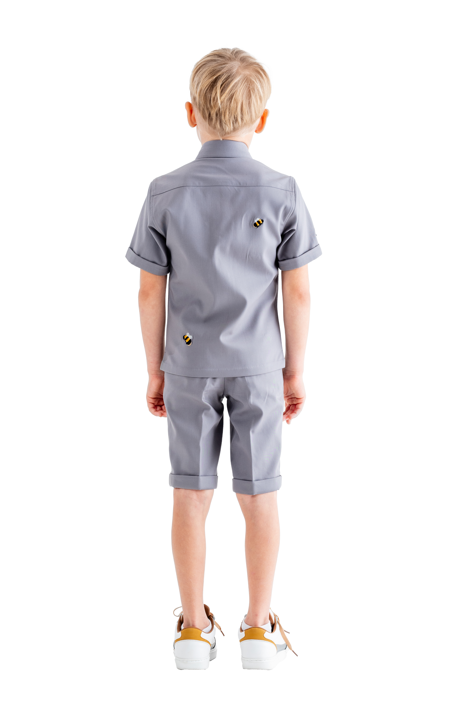 Rhyme Kids - Boy wearing Pebble Grey Rhyme by Rupamani short-sleeve shirt and matching shorts.