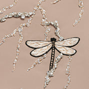 Cleo mocha girls dress detail — crystal and bead embroidery on beige crepe fabric