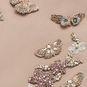 Piera girls dress detail — hand-embroidered crystal and bead texture on beige crepe