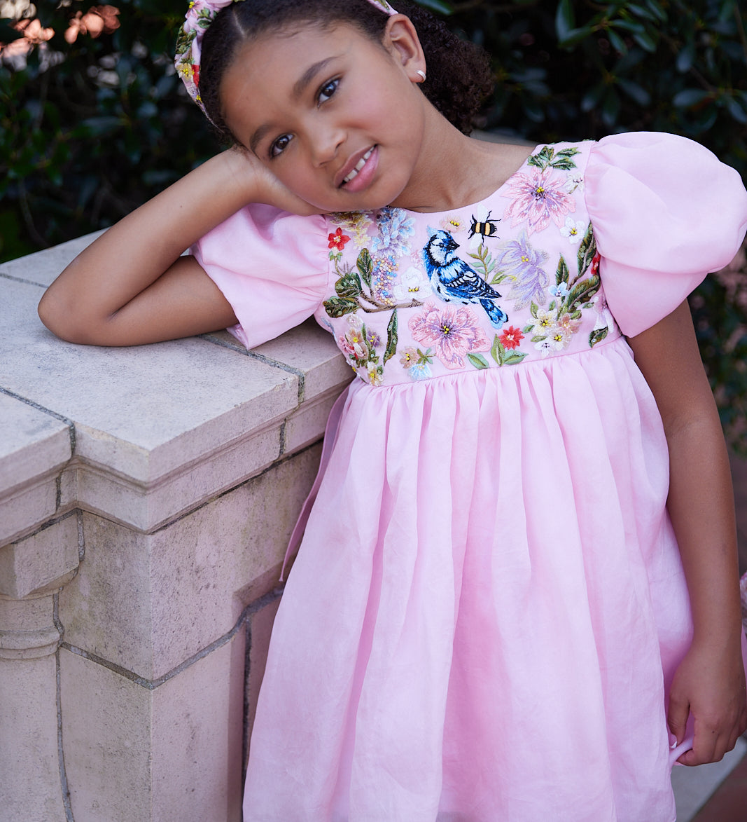 Rhyme Kids - Pink puff-sleeve dress with floral embroidery and bluebird detail by Rhyme by Rupamani.