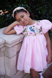 Rhyme Kids - Pink puff-sleeve dress with floral embroidery and bluebird detail by Rhyme by Rupamani.