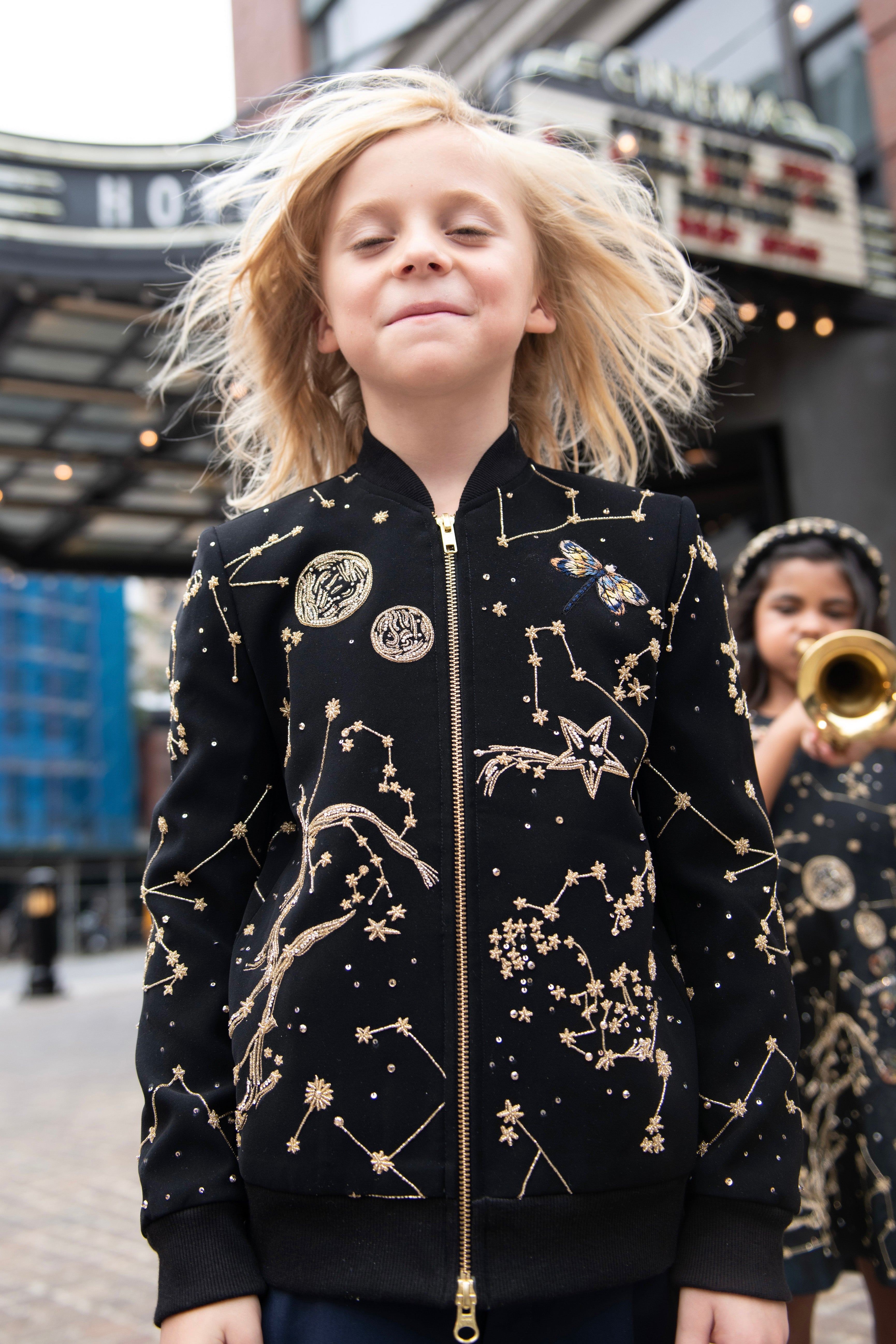 Storm boys velvet bomber jacket lifestyle photo — luxury children's occasion wear by Rhyme Kids